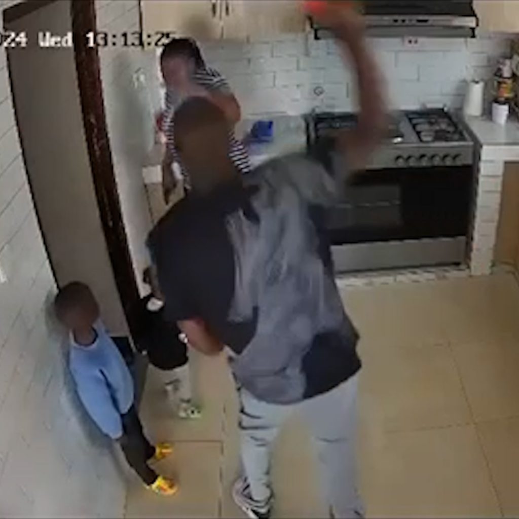 Shocking CCTV Footage Shows Man Attacking Woman in Kitchen as Children Watch in Terror